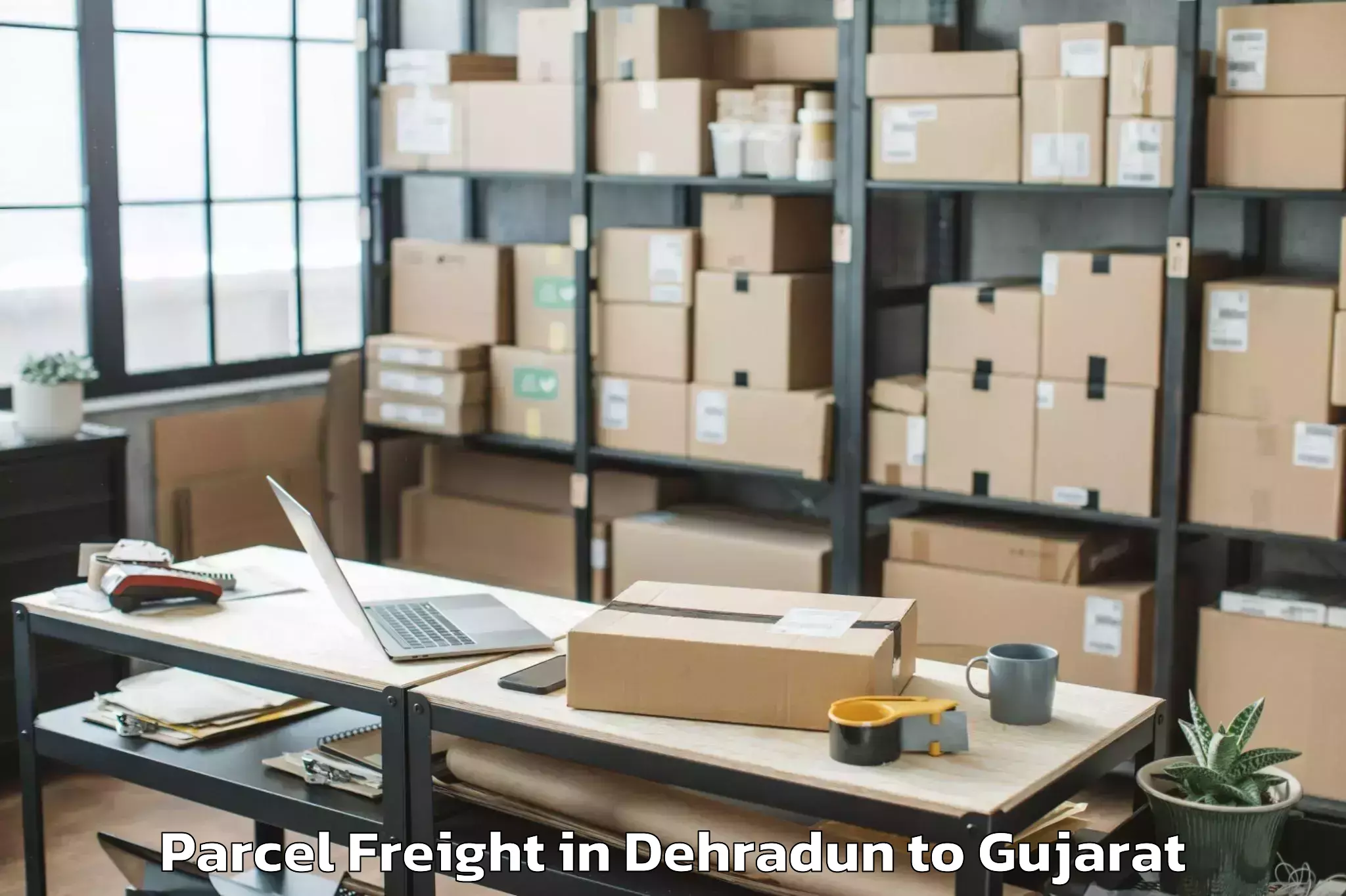 Easy Dehradun to Ambaji Parcel Freight Booking